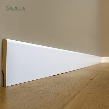 White skirting board on wooden floor